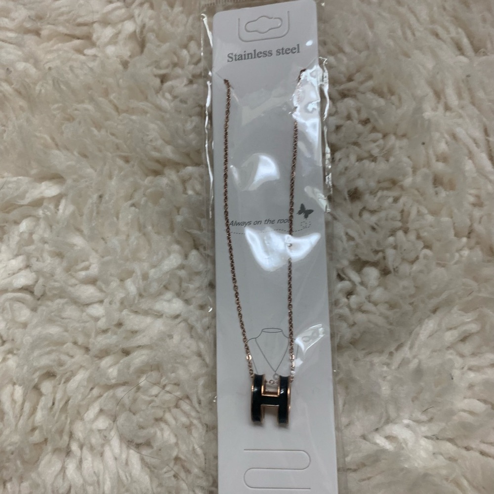 Gold Tone Necklace with Black H Pendant